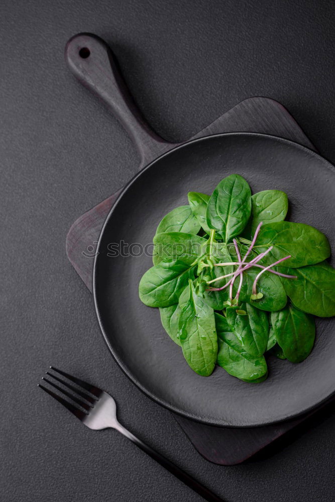 Similar – spinach in a round cast-iron frying pan