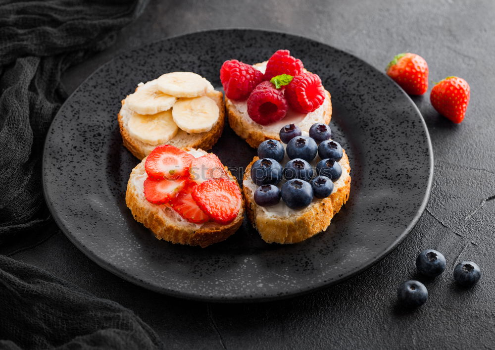 Similar – Delicious tartlets with raspberries and blueberries