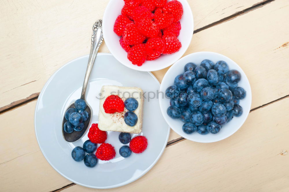 Similar – Delicious tartlets with raspberries and blueberries