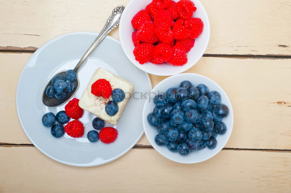 Similar – Delicious tartlets with raspberries and blueberries