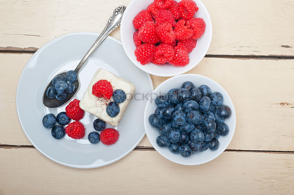 Similar – Delicious tartlets with raspberries and blueberries