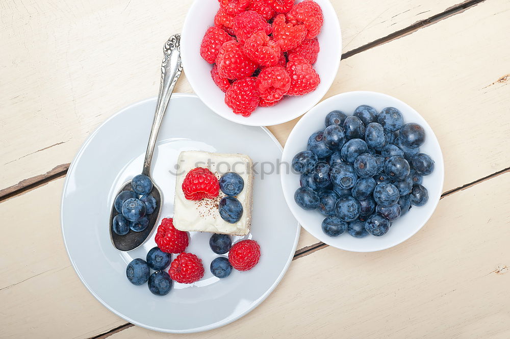 Similar – Delicious tartlets with raspberries and blueberries