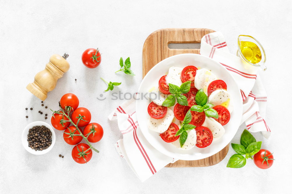 Similar – Parma ham with toast , basil pesto and tomatoes