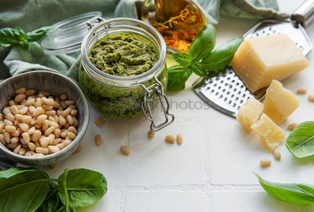 Similar – Green kale pesto in glass on dark rustic kitchen table background with ingredients, top view. Kale preparation. Healthy detox vegetables . Clean eating and dieting concept.