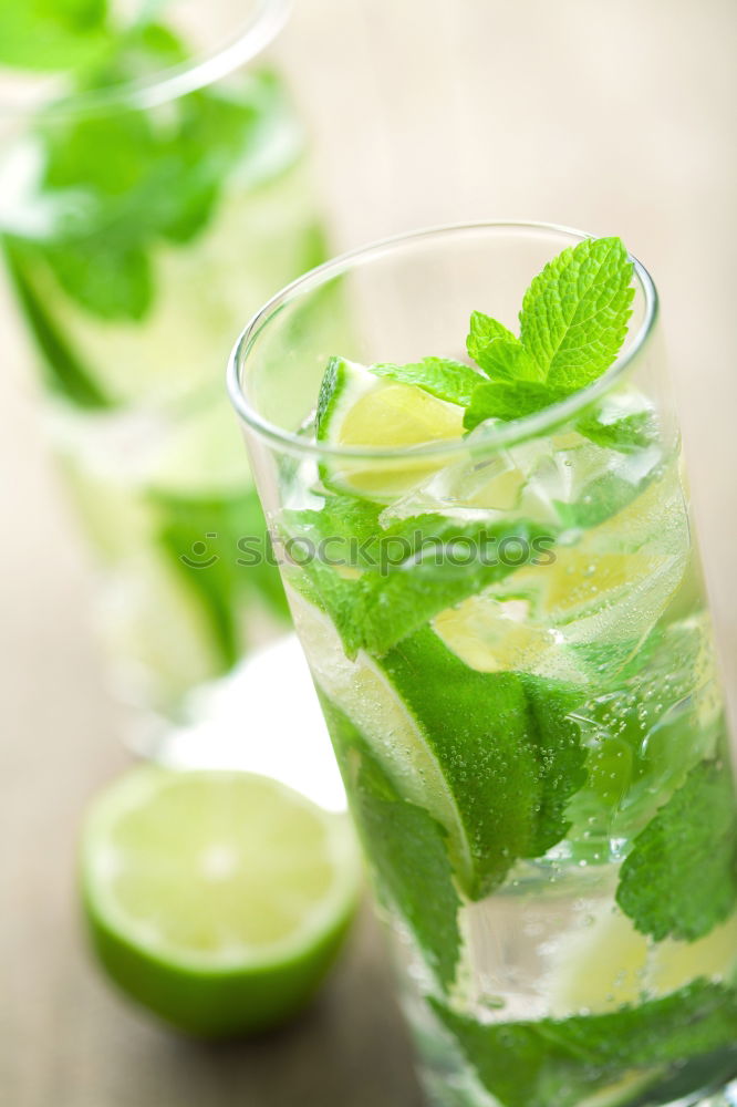 Similar – Mojito cocktail in glass on yellow background