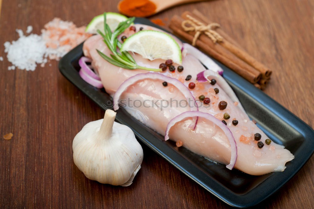 Red onion and lemon on zander fish