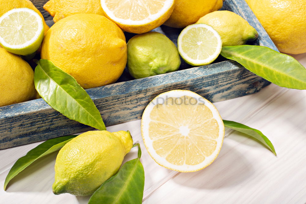 Similar – Image, Stock Photo ripe yellow lemons and lime, mint green