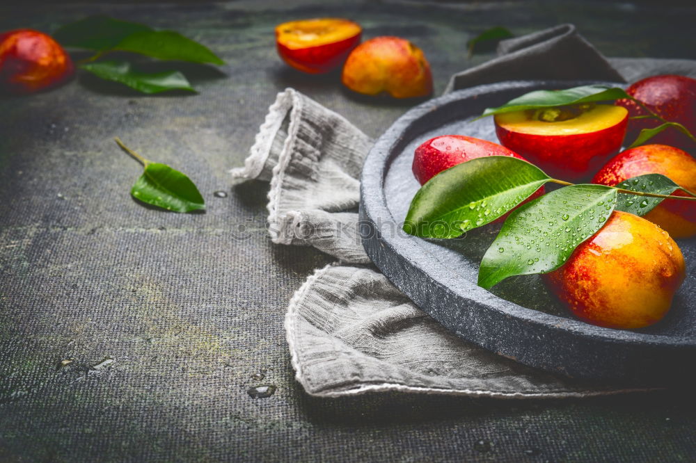 Similar – Image, Stock Photo Fresh peaches with green leaves on stone slab