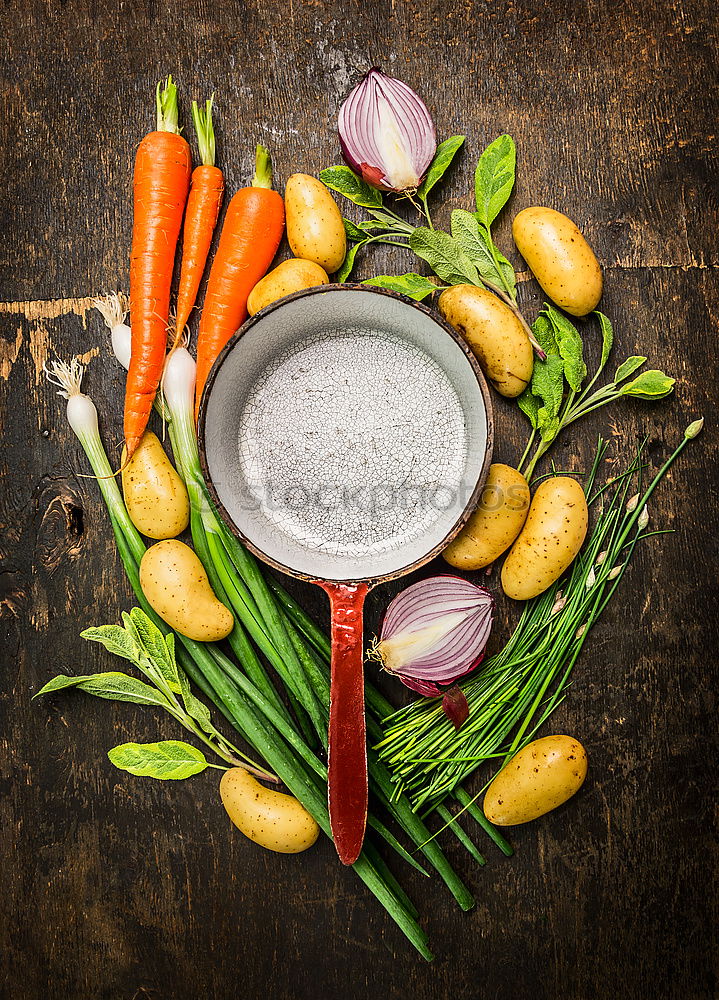 Similar – Image, Stock Photo Preparing young potatoes on a wooden table