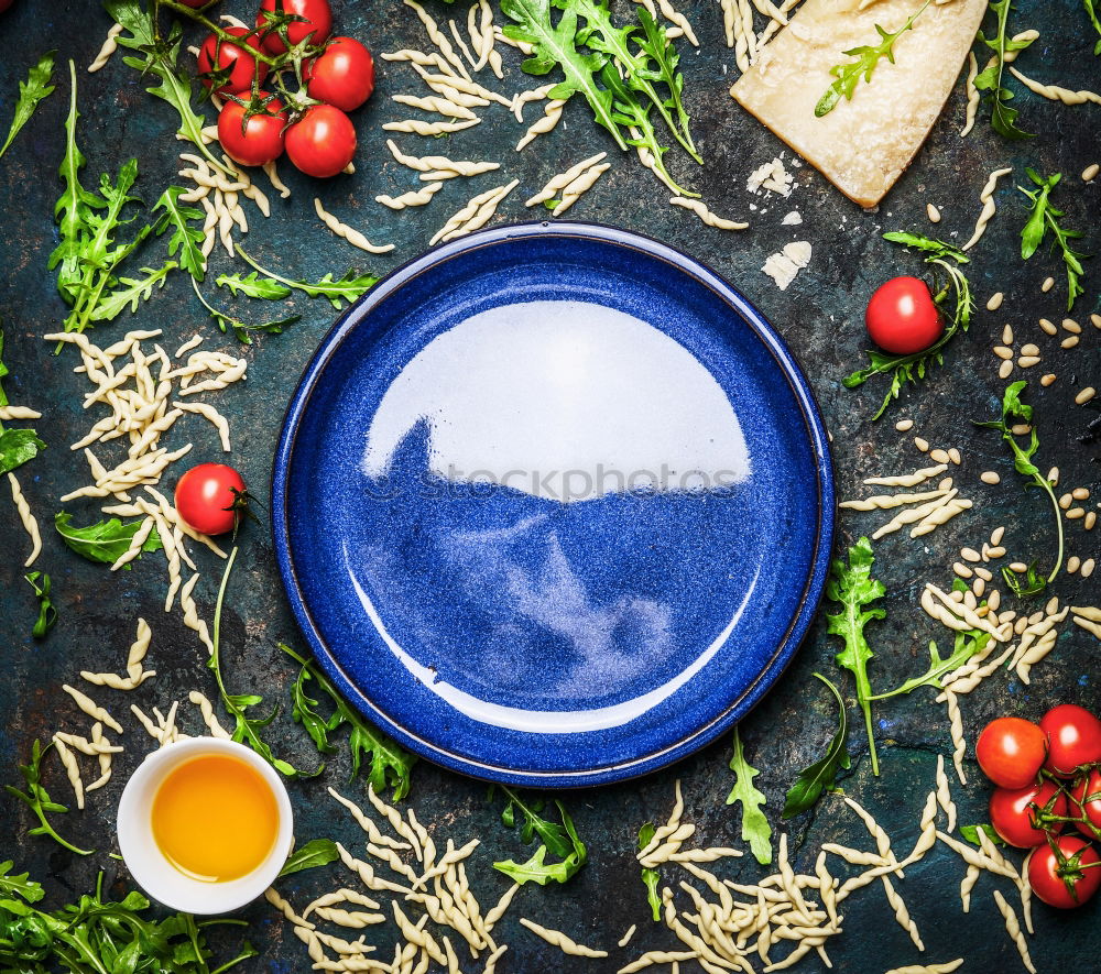 Image, Stock Photo Pasta with ingredients for tasty cuisine around empty plate