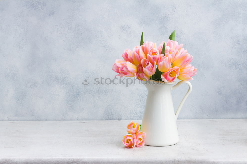 Similar – Watering can with garden flowers