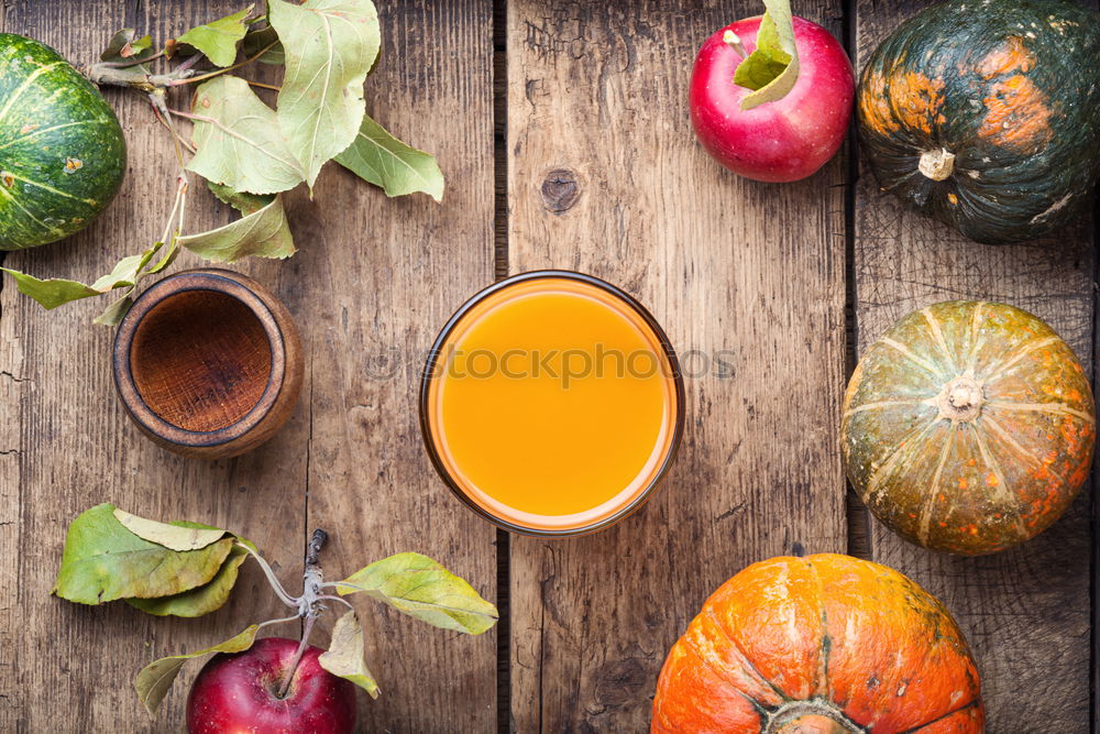 Similar – Juice in a mug on a gray wooden surface