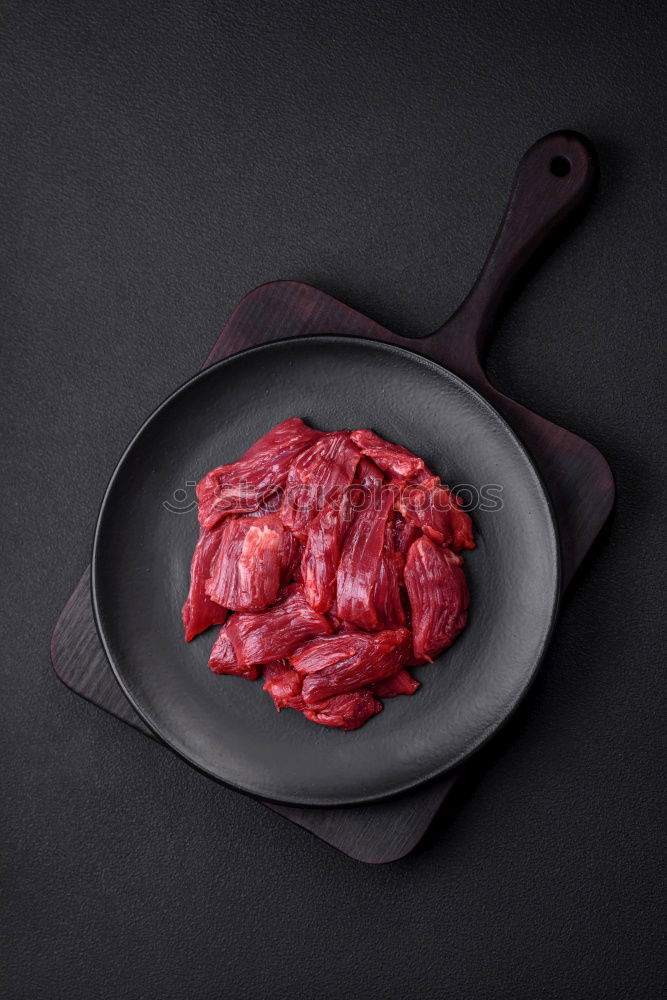 Similar – Image, Stock Photo Steaks with ingredients on a round chopping board