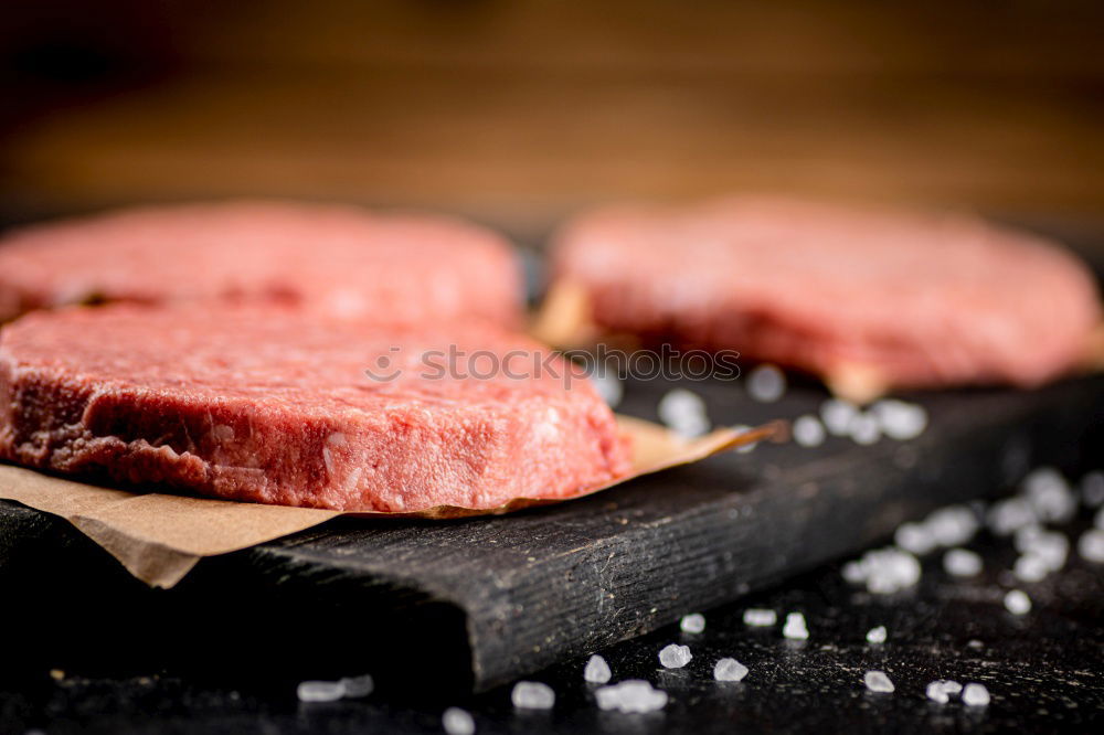 Similar – Image, Stock Photo Schnitzel meat on a rustic wooden table