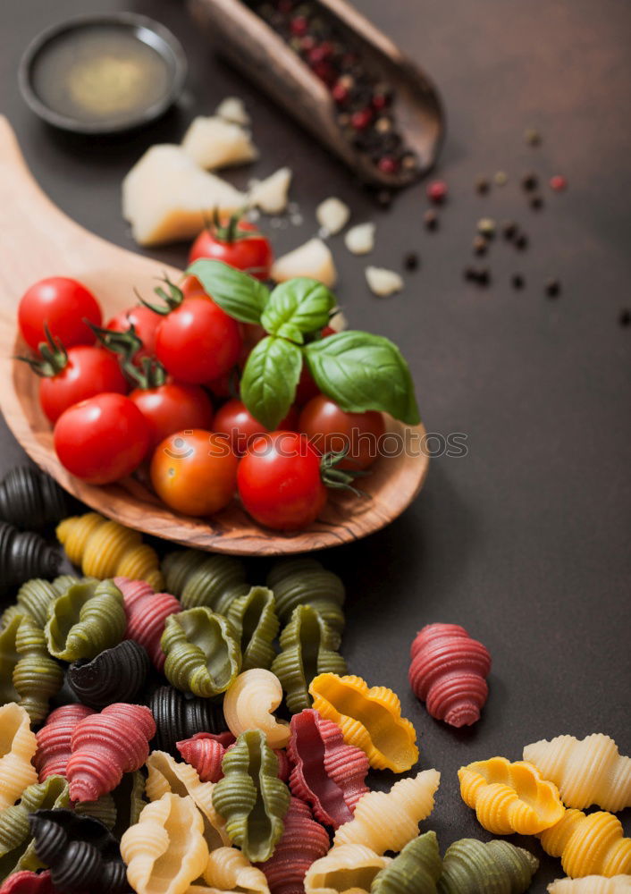 Similar – Raw italian pasta, basil and vegetables