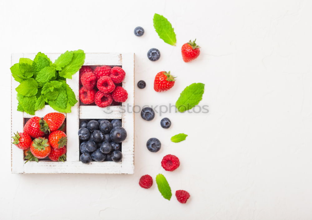 Similar – Delicious tartlets with raspberries and blueberries