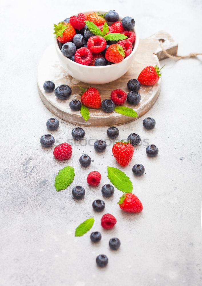 Similar – Delicious tartlets with raspberries and blueberries