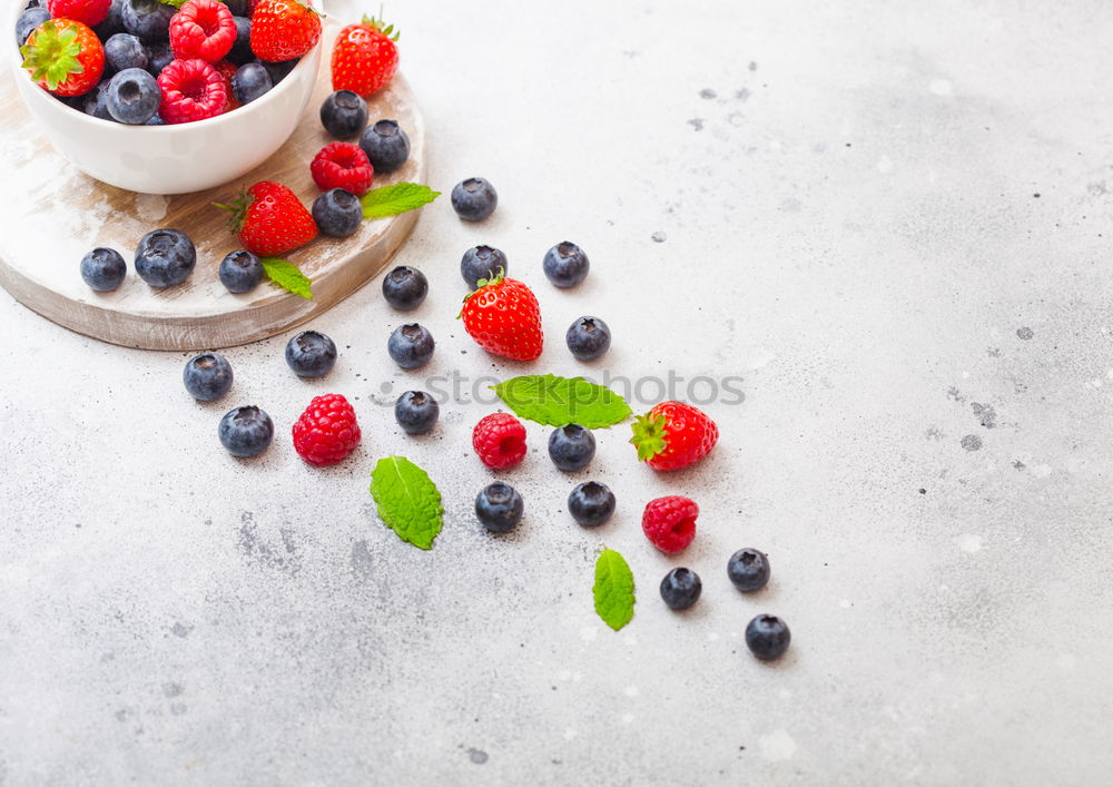 Similar – Healthy breakfast with fresh berries, muesli and nuts