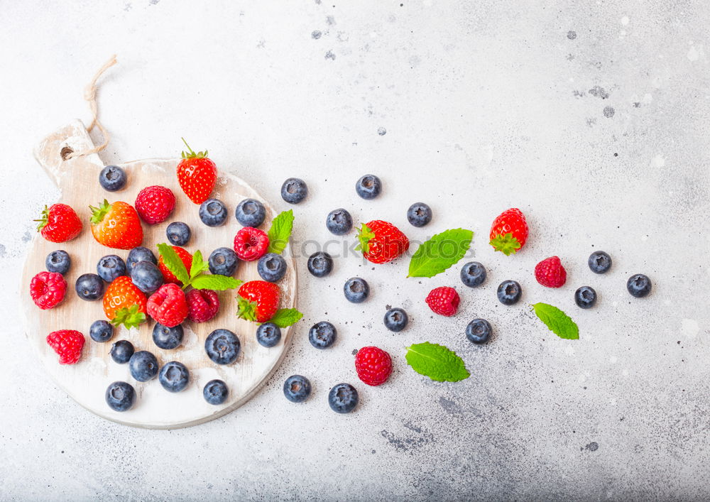 Similar – Healthy breakfast with fresh berries, muesli and nuts