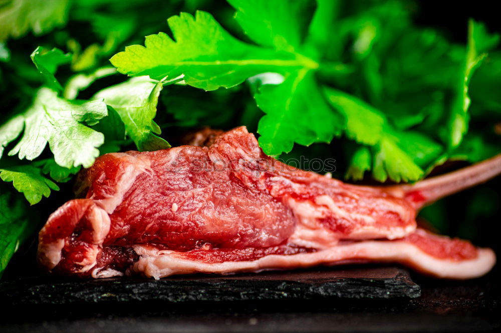 Image, Stock Photo Lamb Racks on kitchen table with green ingredients