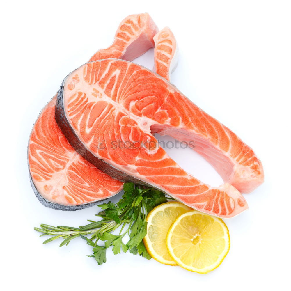 Similar – Raw salmon fillet with green herbs and lemon