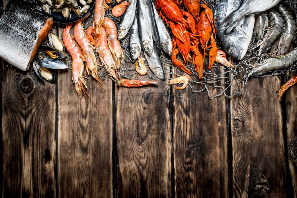 Similar – Three live carp fish in a scales on a kitchen board