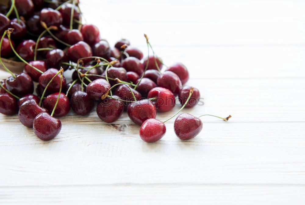 Similar – Image, Stock Photo Red grapes on an old wooden table close up