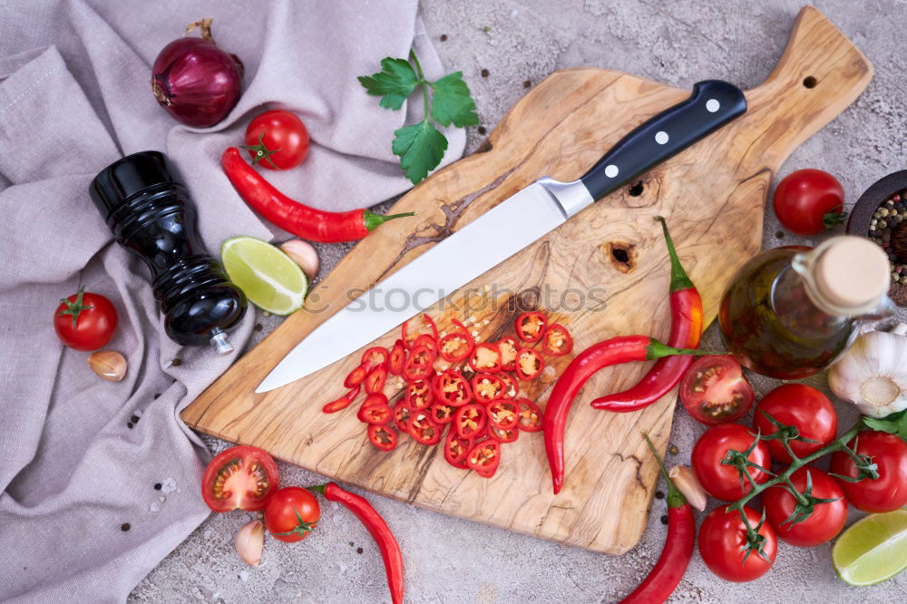 Similar – Image, Stock Photo cutting board with a knife and fresh red cherry tomatoes