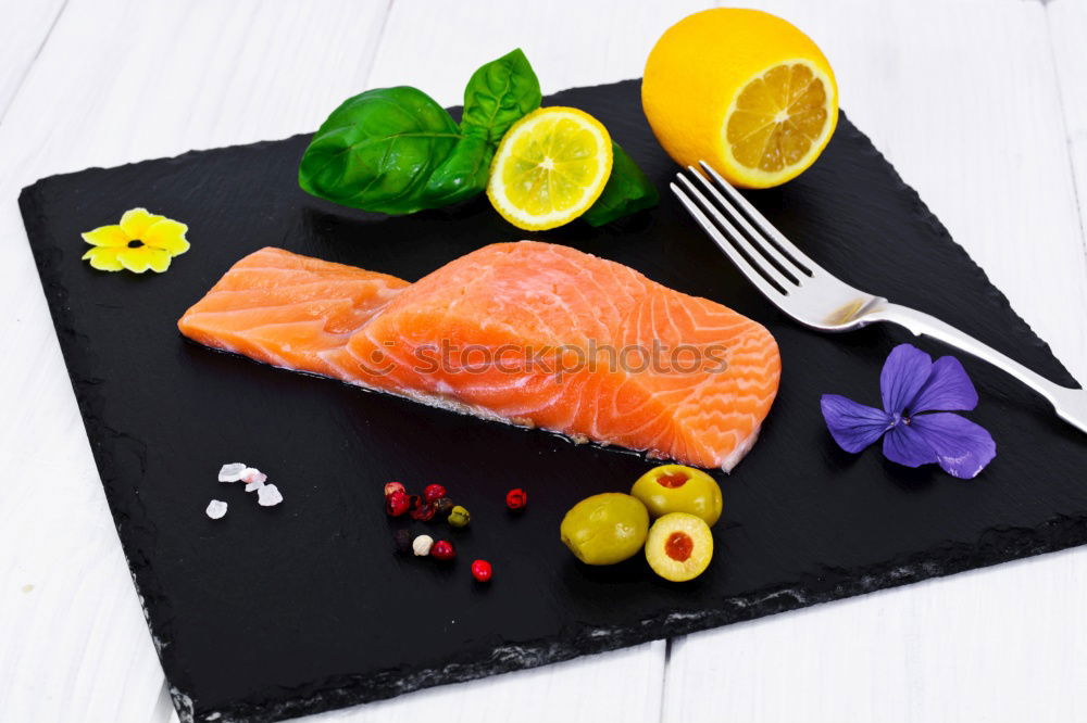 Similar – Salmon fish fillet with lemon in bowl