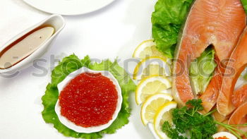 Similar – Raw salmon fillet with green herbs and lemon