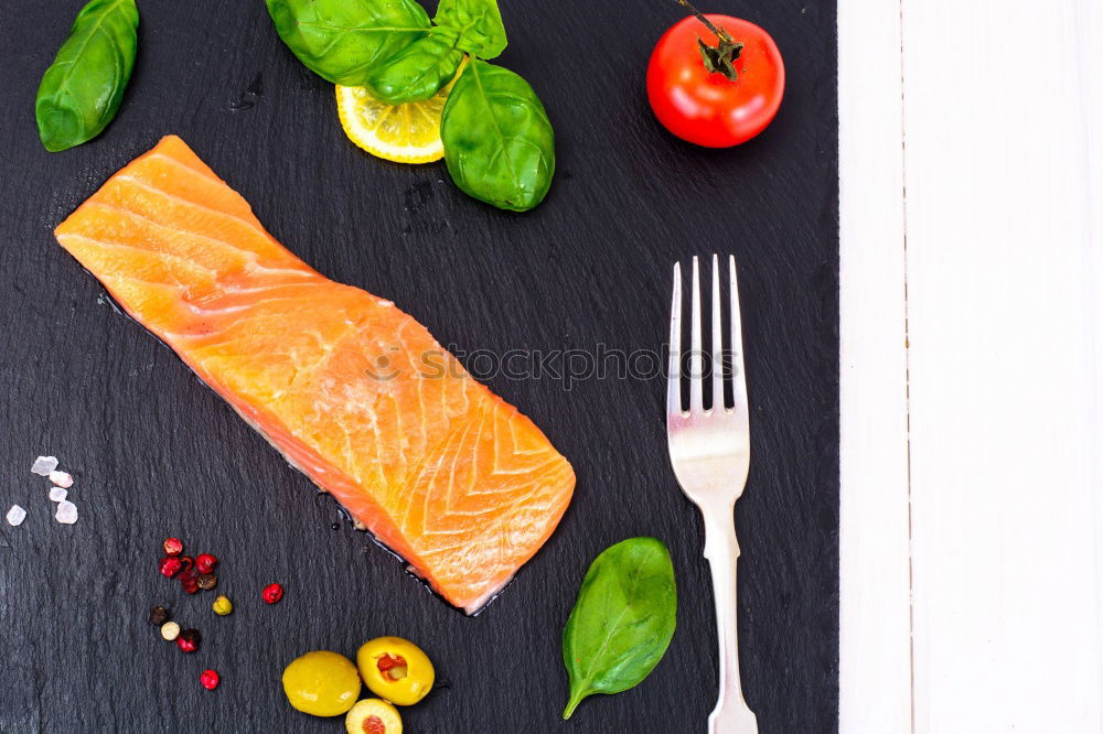 Similar – Salmon with spinach on a white kitchen table