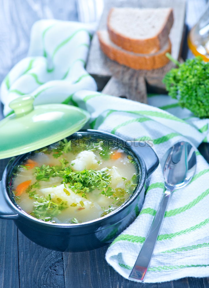 Similar – Spinach in cream sauce in casserole dish with spoon