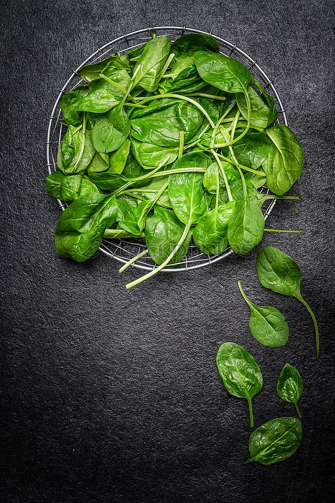 Similar – spinach in a round cast-iron frying pan