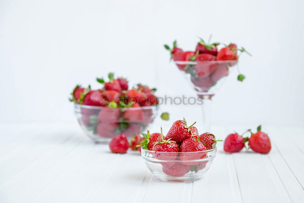 Similar – Pink sweet lemonade made of raspberry juice with frosted blackberries and strawberry blossom in a glass with sugar rim and drinking straw on striped tablecloth