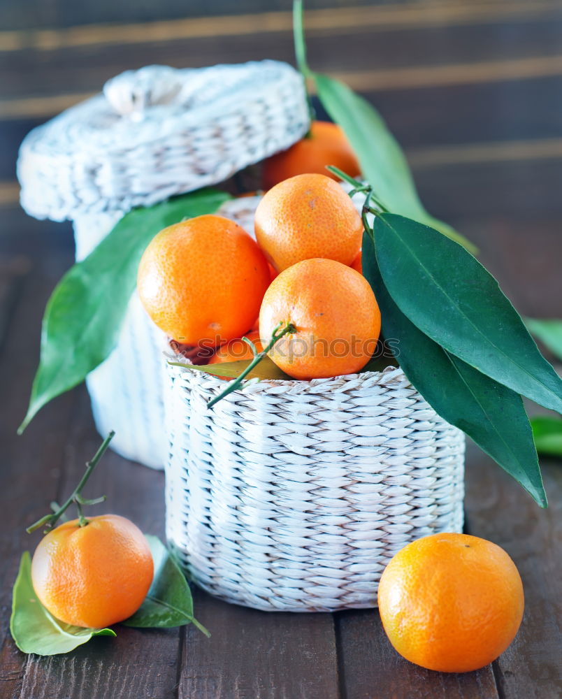 Similar – Image, Stock Photo Tangerines with green leaves in the blue bowl