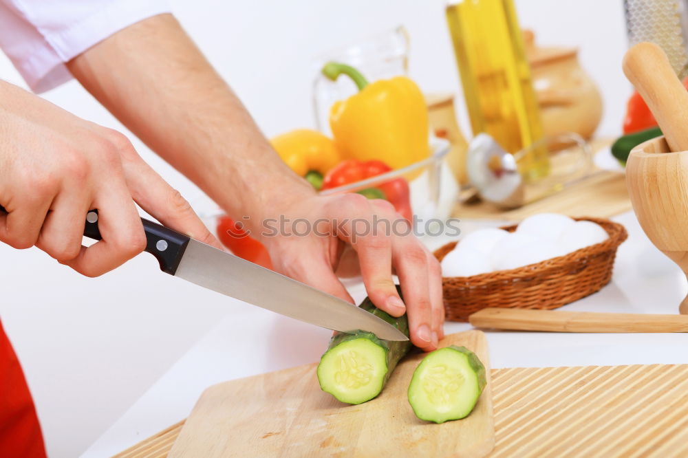 Similar – Image, Stock Photo Mother teaches daughter knife cut cucumber