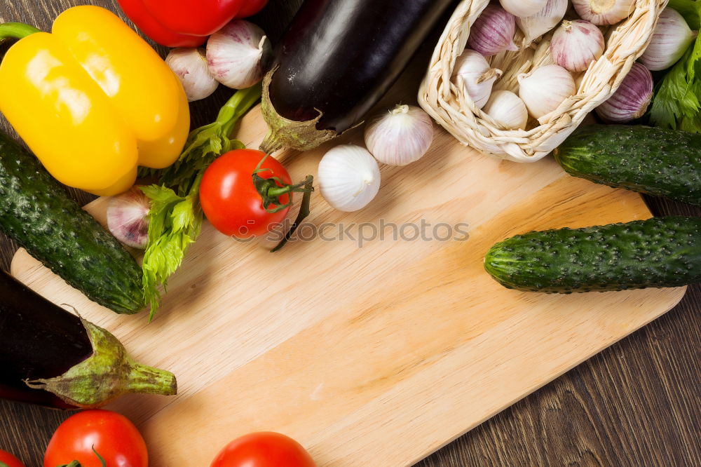 Similar – Vegetables and utensils on kitchen table