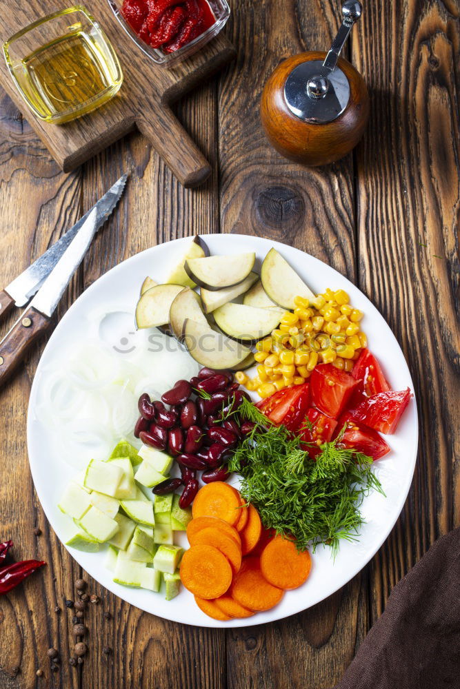 Spices and oil near knife