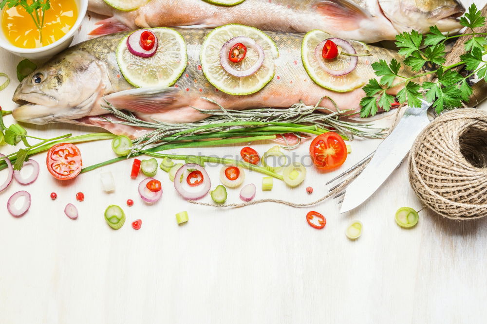 Similar – Image, Stock Photo Raw salmon fish in ice and vegetables