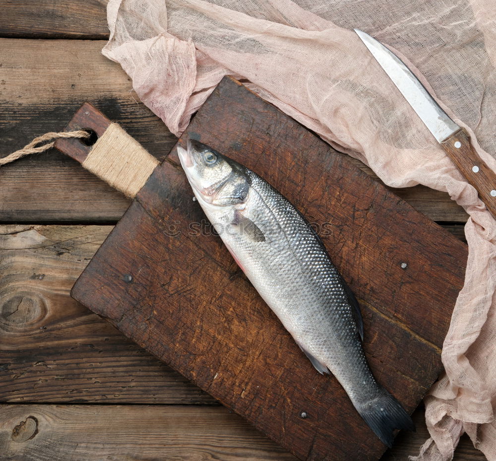 Similar – Frozen fish smelt on the kitchen board