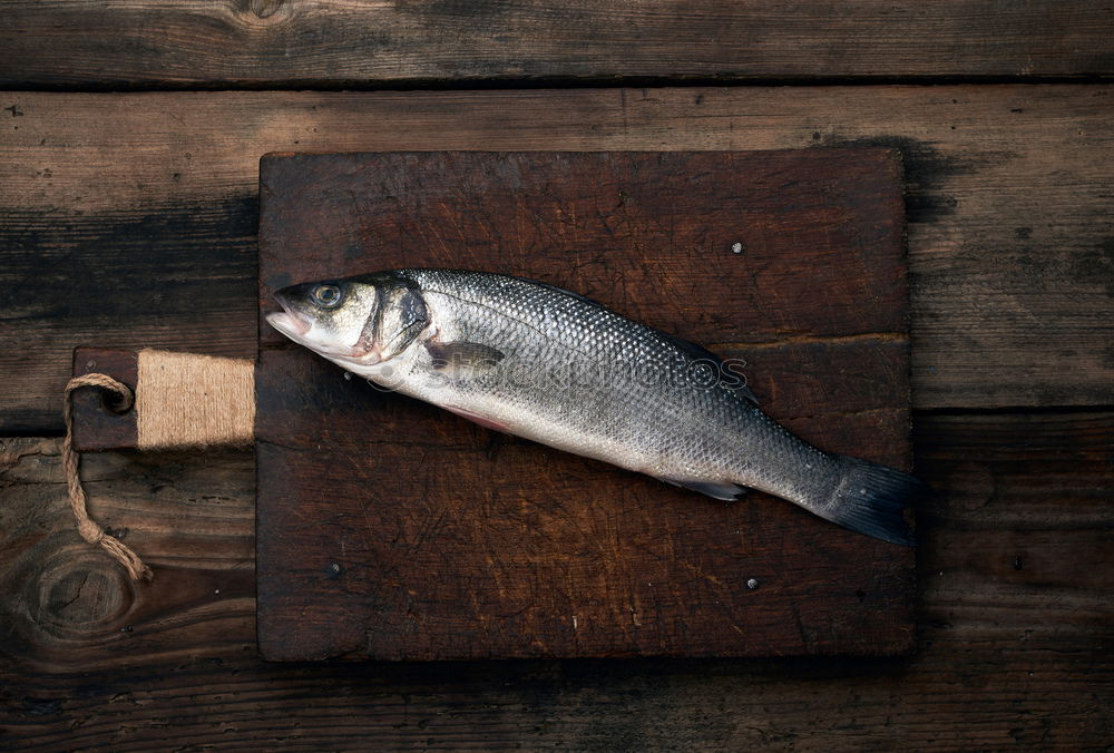 Similar – Frozen fish smelt on the kitchen board