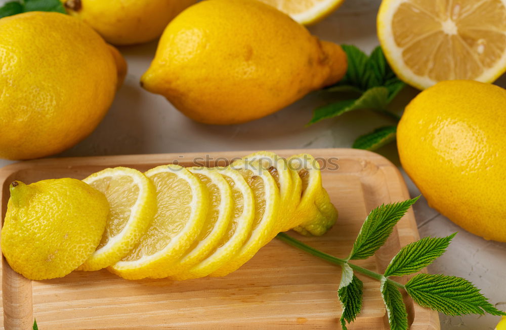 Similar – Image, Stock Photo ripe yellow lemons and lime, mint green