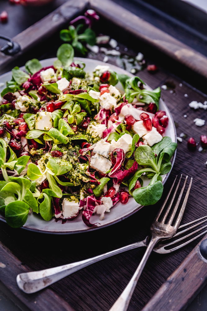 Similar – Green salad with pomegranate, manna croup, onion