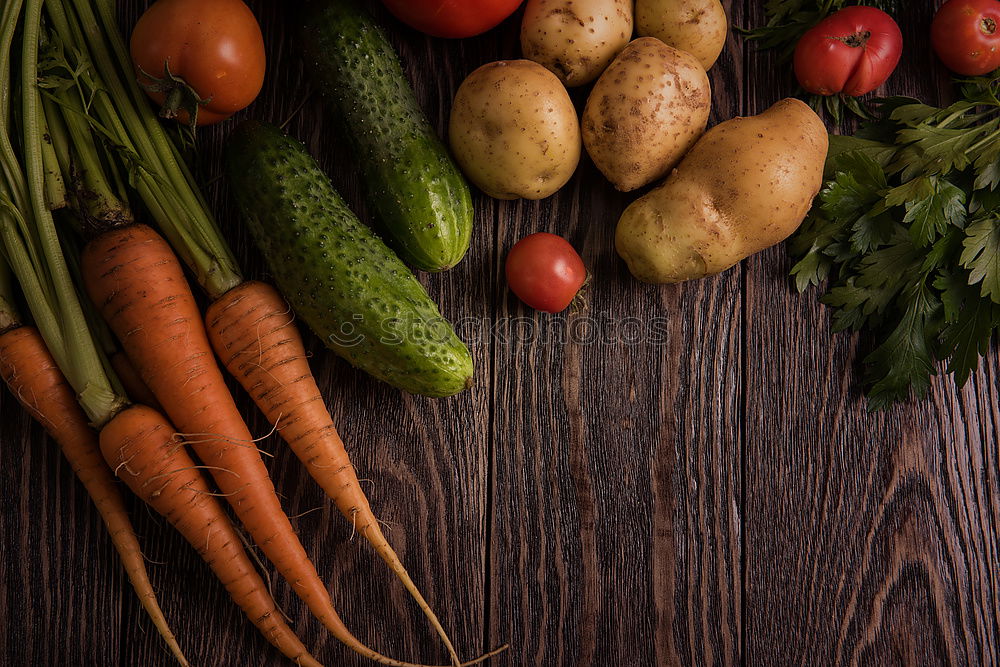 Similar – Fresh carrots and onions on a gray wooden table