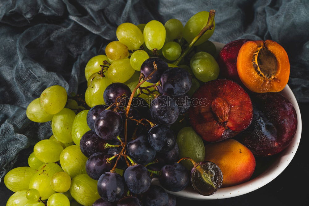 Similar – Image, Stock Photo Colorful tomatoes on the kitchen table with basil