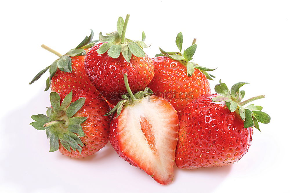 Similar – Strawberries whole and cut on a white wooden table