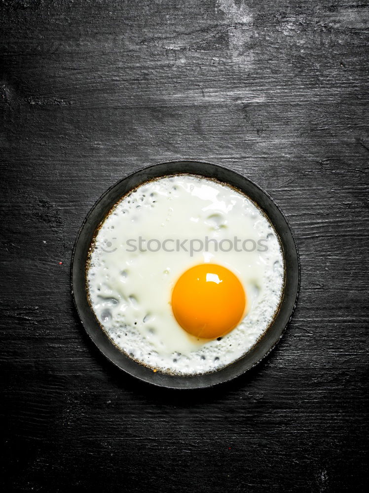 Similar – Fried egg in a old frying pan