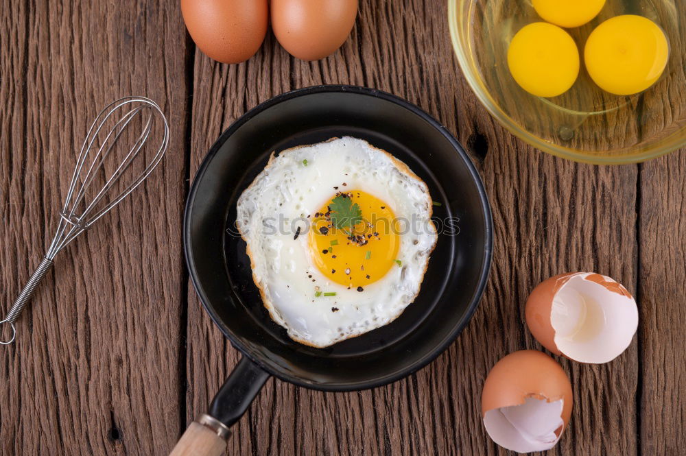 Similar – Image, Stock Photo Fried egg face with slice of bread