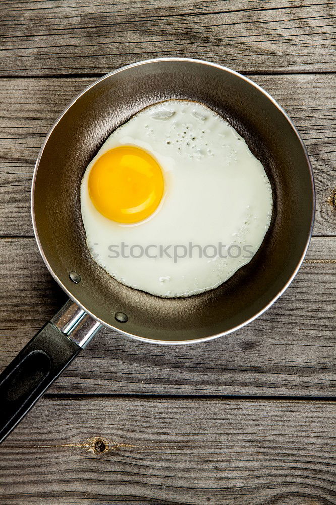 Similar – Fried egg in a old frying pan