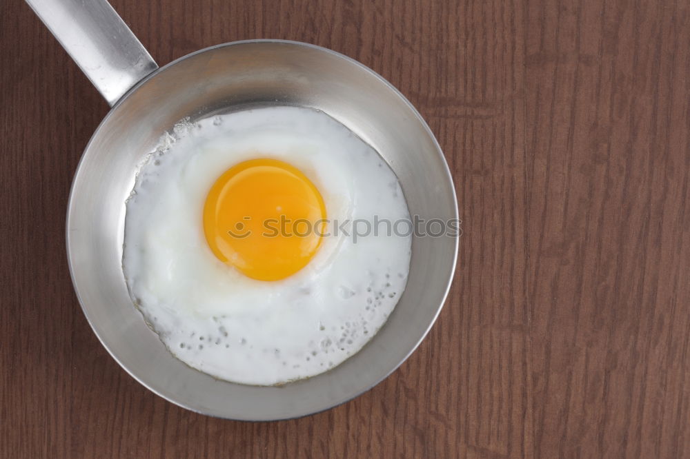 Similar – Fried egg in a old frying pan